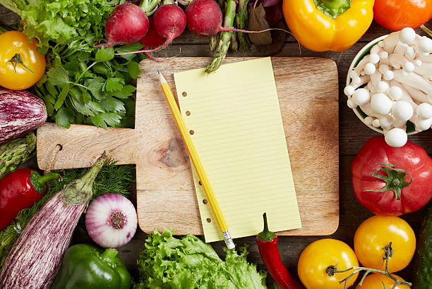Shopping list and vegetables Blank shopping list, cutting board and vegetables shopping list stock pictures, royalty-free photos & images