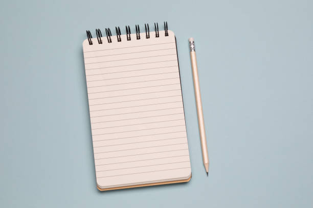 Shopping list Spiral notebook and pencil on blue background shopping list stock pictures, royalty-free photos & images