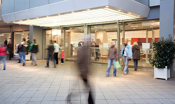 Shopping Mall Entrance with People Walking stock photo