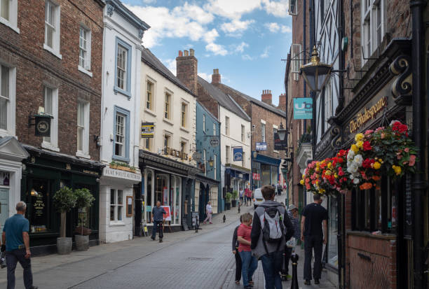Shopping street in a center of  historic town Durham in North East England. Durham, United Kingdom - July 30, 2018: Shopping street in a center of  historic town Durham in North East England. durham stock pictures, royalty-free photos & images