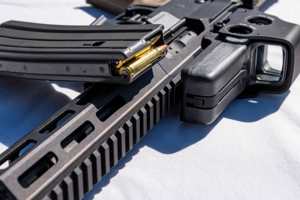A short barreled AR15 with a loaded magazine on it stock photo