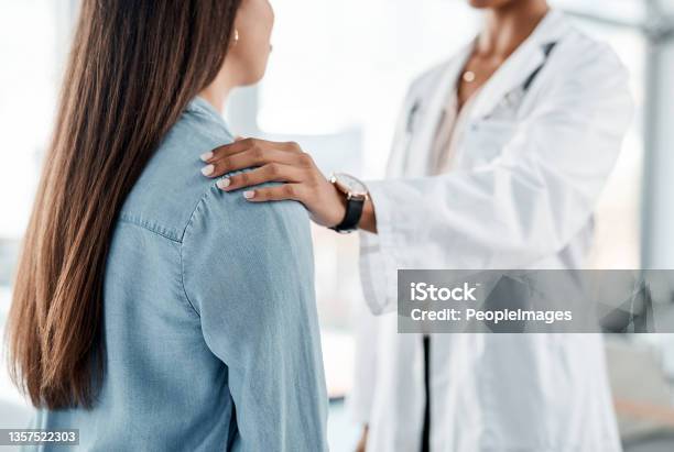 Shot of a female doctor comforting her patient