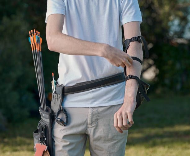 Shot of a male archer setting up his equipment stock photo
