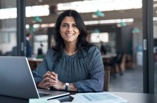 Shot of a mature businesswoman using a laptop in a modern office stock photo