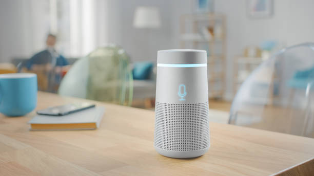 Shot of a Smart Speaker with Artificial Intelligence Assistant Standing on the Table in Bright Cozy Living Room. Shot of a Smart Speaker with Artificial Intelligence Assistant Standing on the Table in Bright Cozy Living Room. speech recognition stock pictures, royalty-free photos & images