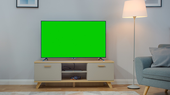 Shot Of A Tv With Horizontal Green Screen Mock Up Cozy Living Room At ...