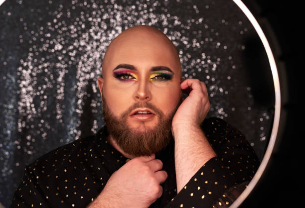 Shot of a young man wearing theatrical makeup in a studio stock photo