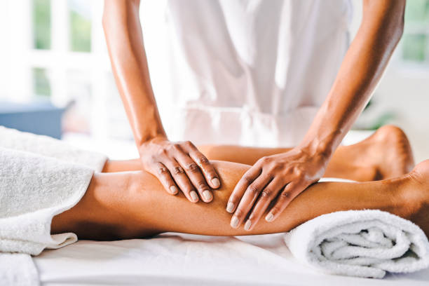 Shot of an unrecognisable young woman getting getting massaged at a beauty spa stock photo