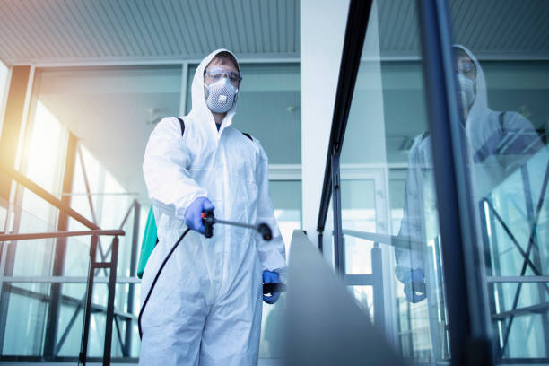 Shot of male person in white chemical protection suit doing disinfection of public areas to stop spreading highly contagious corona virus. Stop coronavirus or COVID-19.  disinfection stock pictures, royalty-free photos & images