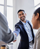 istock Shot of two business people shaking hands during a meeting 1358724438