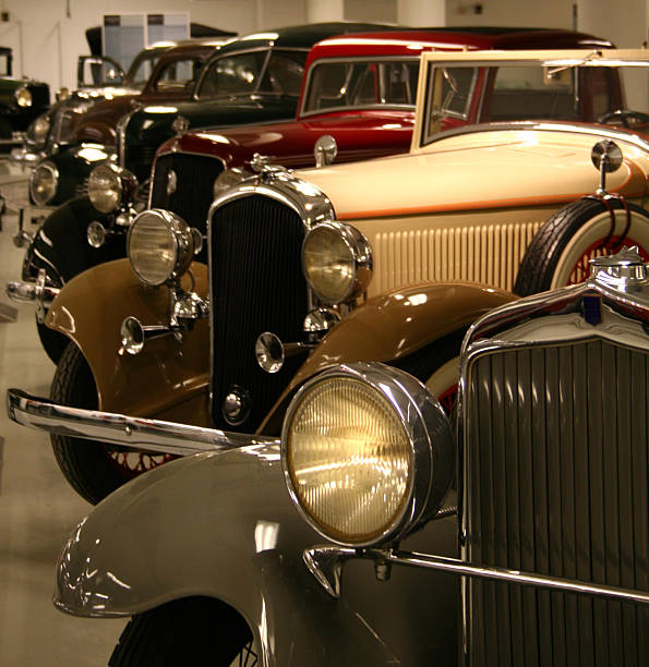 A showroom with a collection of vintage cars stock photo