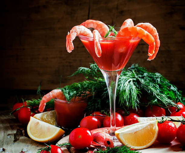 Shrimp cocktail in a martini glass, vegetables, spices stock photo