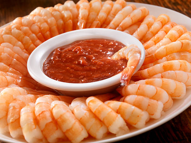 Shrimp Ring with Cocktail Sauce Shrimp Ring with Cocktail Sauce -Photographed on Hasselblad H3D2-39mb Camera shrimp cocktail stock pictures, royalty-free photos & images