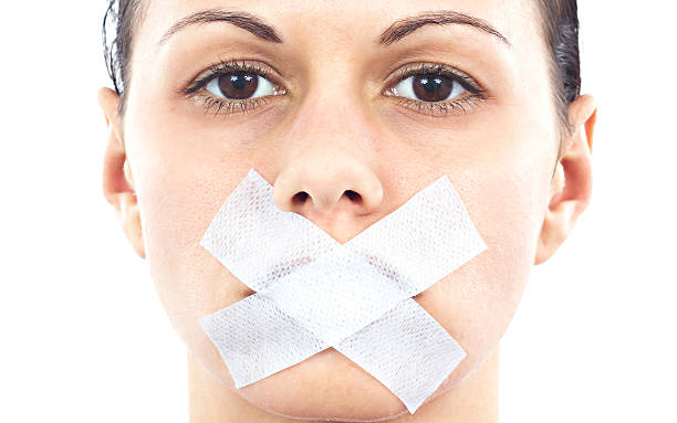 Shut up! http://i1364.photobucket.com/albums/r725/hofi99/UJBANNER2/andrea_banner_zps2cf1a621.jpg human mouth gag adhesive tape women stock pictures, royalty-free photos & images