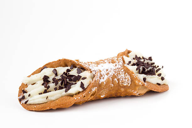 Sicilian cannolo Sweet homemade sicilian cannolo stuffed with ricotta cheese cream and chocolate flakes cannoli stock pictures, royalty-free photos & images
