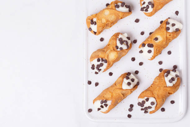 Sicilian dessert cannoli with chocolate Traditional sicilian dessert cannoli with chocolate and ricotta. Italian cuisine cannoli stock pictures, royalty-free photos & images