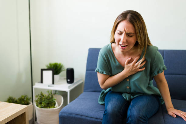 Sick woman needs to go to the emergency room stock photo