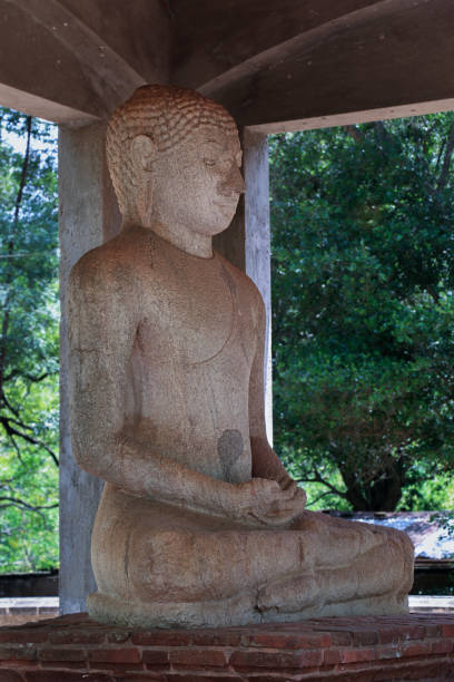 Side Angled View of Granite Samadhi Buddha Statue in the posture of Dhyana Mudra, Mahamewna Park, Anuradhapura, Sri Lanka stock photo