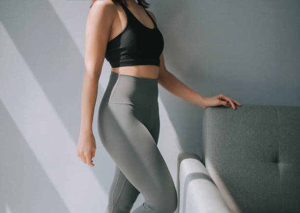 side view mid section of asian chinese woman with yoga pants sport clothing sexual sporty sportive tempting beautiful attractive nice round tight pants leggings  asian yoga pants stock pictures, royalty-free photos & images