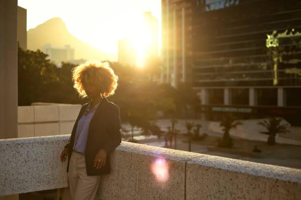 Side view of woman during the sunset Focused and confident young woman after a long day at work golden hour stock pictures, royalty-free photos & images