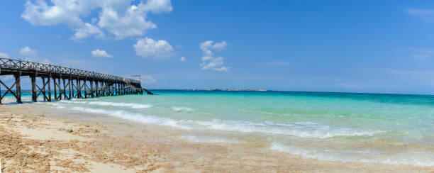 Side view of wood pier at Prison Island in Zanzibar stock photo