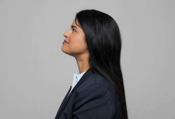 Side view of young businesswoman stock photo