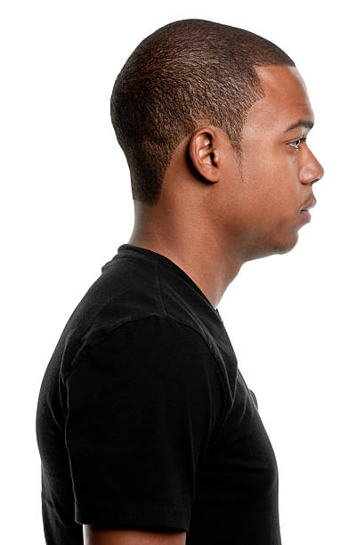 Side View Profile Portrait of Serious Young Man Portrait of a young male on a white background. http://s3.amazonaws.com/drbimages/m/courow.jpg high key stock pictures, royalty-free photos & images