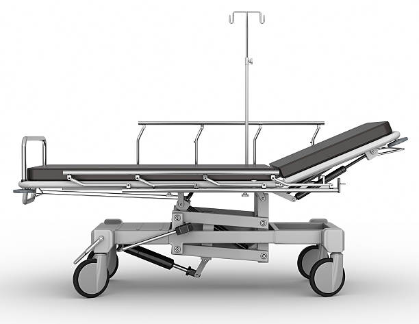 Side-profile view of stretcher parked on white background stock photo