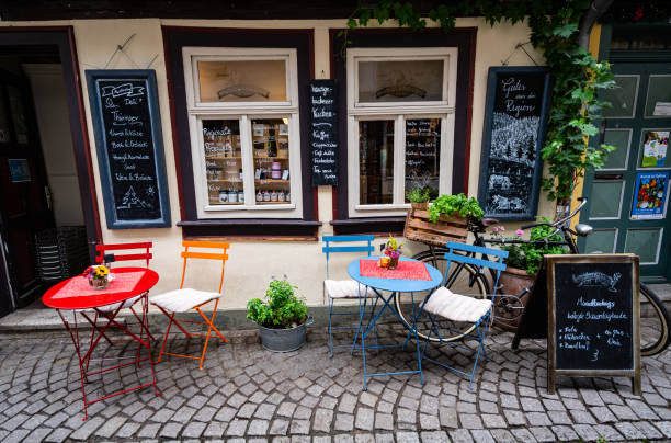 Sidewalk café on the Krämerbrücke (Merchants' bridge) in Erfurt, stock photo