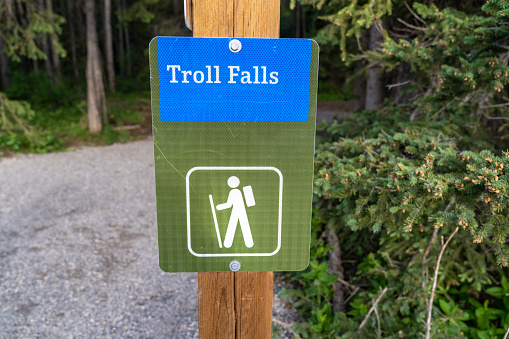Sign at the Troll Falls waterfall trailhead in Kananaskis Country Canada