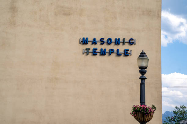 Sign for a masonic temple with a lightpost Sign for a masonic temple with a lightpost freemason stock pictures, royalty-free photos & images
