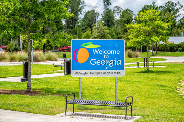 Sign for Welcome to Georgia center from SC at Visitor Center rest area and symbol for peach on i95 highway stock photo