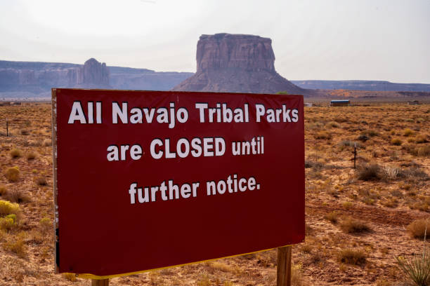 Sign in Monument Valley Arizona Navajo Tribal Park Saying the the Park is Closed Due to Covid-19 Corona Virus During the Pandemic Sign in Monument Valley Arizona Navajo Tribal Park Saying the the Park is Closed Due to Covid-19 Corona Virus During the Pandemic navajo nation covid stock pictures, royalty-free photos & images