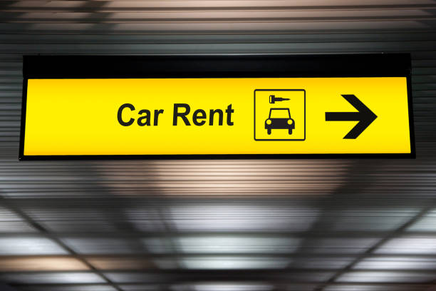 sign with arrow point to rent a car service at the airport for passenger who want to hide a car for travel around city. freedom transportation for convenient travel stock photo