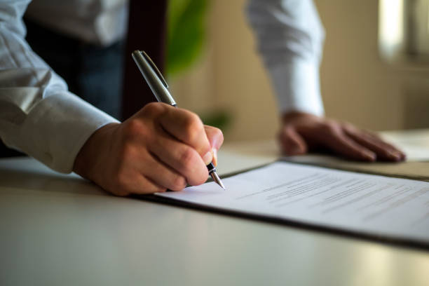 Signing Official Document Signing Official Document contract stock pictures, royalty-free photos & images