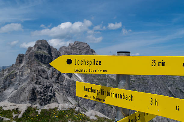 Signpost for hikers in the Allgau mountains near Oberstdorf, Germany Signpost for hikers in the Allgau mountains near Oberstdorf at the border of Germany and Austria lechtal alps stock pictures, royalty-free photos & images