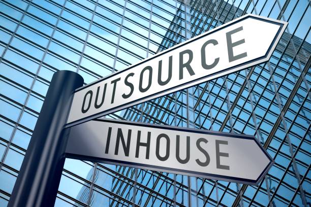 Signpost illustration, two arrows - inhouse, outsource stock photo