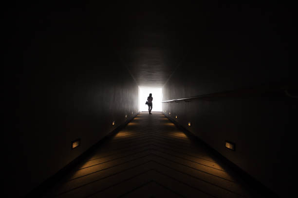 Girl Walking Away Stock Photos, Pictures & Royalty-Free Images - iStock Silhouette Man Walking Tunnel