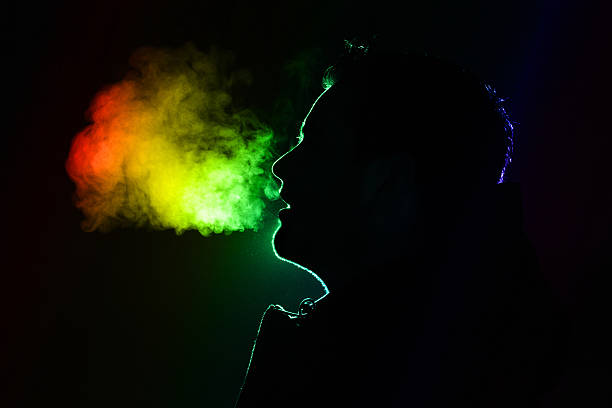 Silhouette of a man Colored outline of a man exhaling warm breath breath vapor stock pictures, royalty-free photos & images