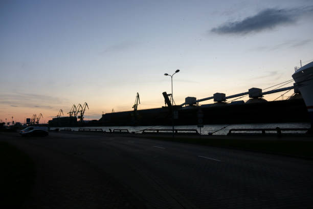 Silhouette of a port with loading facilities and cranes on the Baltic Sea stock photo