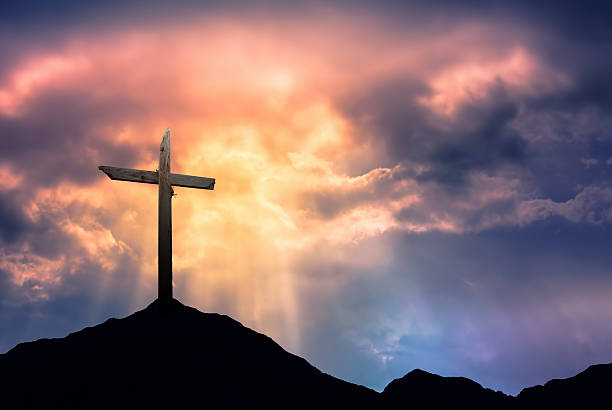 Silhouette of Cross at Sunrise  good friday stock pictures, royalty-free photos & images