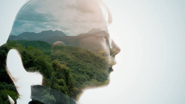 Silhouette of girl and natural landscape. Double exposure. stock photo
