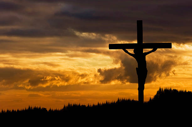 A silhouette of Jesus Christ Crucifixion on Good Friday Silhouette of Jesus Christ crucifixion on cross on Good Friday Easter the crucifixion stock pictures, royalty-free photos & images