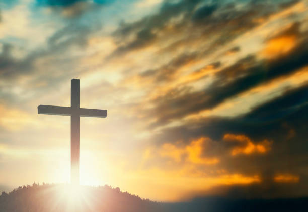 Silhouette of Jesus with Cross over sunset concept for religion, worship, Christmas, Easter, Redeemer Thanksgiving prayer and praise  good friday stock pictures, royalty-free photos & images