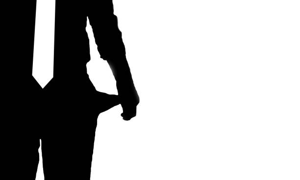 Silhouette of man without money in his pocket stock photo