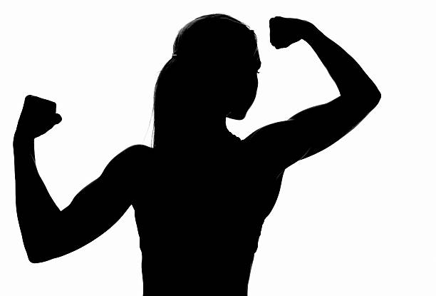 силуэт питания - silhouette of the woman flexing biceps стоковые фото и изо...