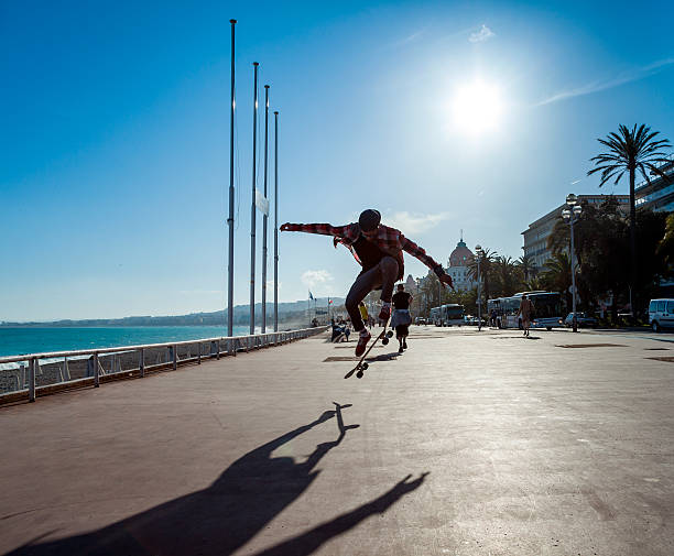 Silhouette of skateboarder stock photo