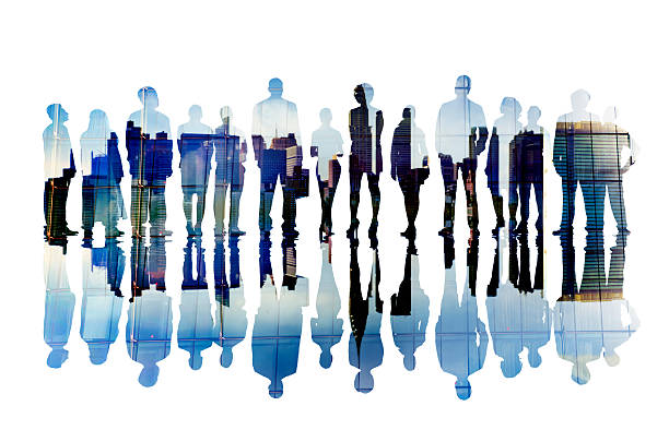 Silhouettes of Business People with Cityscape stock photo