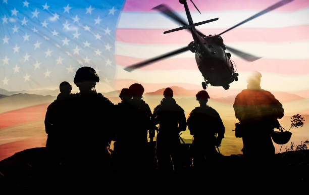 Silhouettes of soldiers during Military Mission against American flag background Silhouettes of soldiers during Military Mission against American flag background infantry stock pictures, royalty-free photos & images