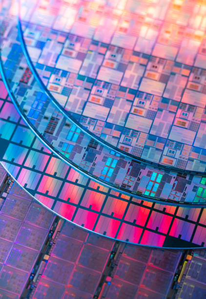silicon wafer reflecting different colors. stock photo